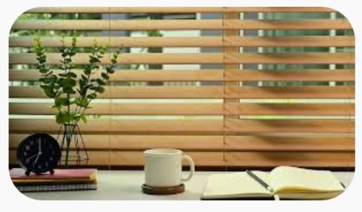Hunter Douglas brand.Faux wood blinds, color brown